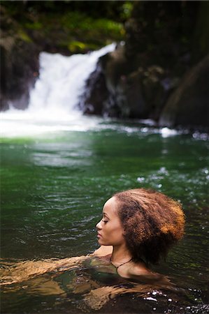 pictures girl swimming to colour - Dominica, Bense. A young woman relaxes in the natural plunge pool at La Chaudiere. (MR). Stock Photo - Rights-Managed, Code: 862-06825224