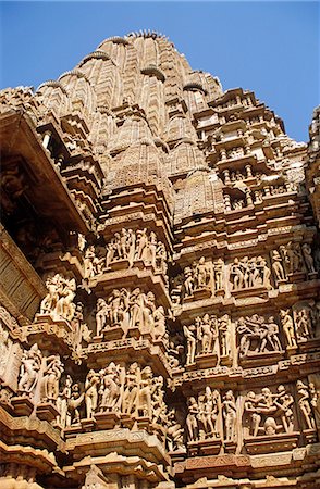 Asia, India, Madhya Pradesh, Khajuraho. Kandariya Mahadev temple, detail of erotic sculptures adorning the exterior. Stock Photo - Rights-Managed, Code: 862-06825841
