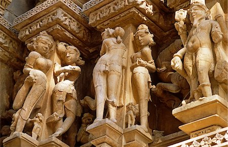 Asia, India, Madhya Pradesh, Khajuraho.  Adinath temple.  Detail of the celestrial maidens carved in stone on the exterior. Stock Photo - Rights-Managed, Code: 862-06825842
