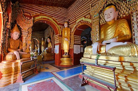 sagaing region - Myanmar, Burma, Sagaing Region, Monywa. Built in 1939, the Thanboddhay Paya, or temple, near Monywa is famed for its extraordinary array of Buddha statues, large and small, that fill its walls and ceilings. Stock Photo - Rights-Managed, Code: 862-06826085