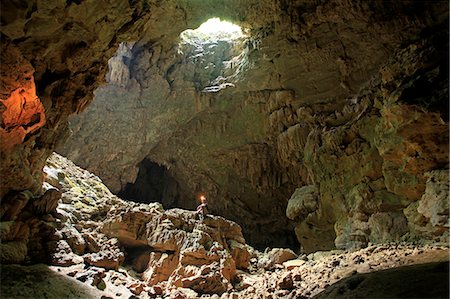 Central America, Belize, Toledo, Rio Grande, San Miguel, Tiger cave, a model in the cave wearing a caving helmet (MR) Stock Photo - Rights-Managed, Code: 862-07495797