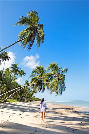 South America, Brazil, Alagoas, Praia do Patacho,  a young woman walking along the deserted beach MR Stock Photo - Rights-Managed, Code: 862-07689835