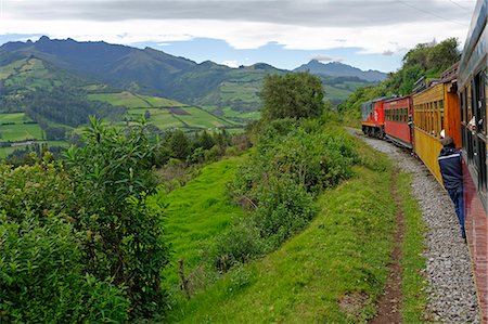 simsearch:841-07083701,k - Ecuador, Pichincha. Ecuador's 'Tren Crucero', or Cruise Train, heads south of Quito through a lush landscape nicknamed the Avenue of Volcanoes by Prussian explorer Alexander von Humboldt in the early 1800s. Stock Photo - Rights-Managed, Code: 862-07689891