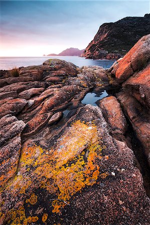 Freycinet National Park, Tasmania, Australia. Sunrise over rocky coast Stock Photo - Rights-Managed, Code: 862-07909357