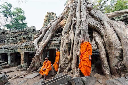 Cambodia, Siem Reap, Angkor Wat complex. Monks inside Ta Prohm temple (MR) Stock Photo - Rights-Managed, Code: 862-07909530