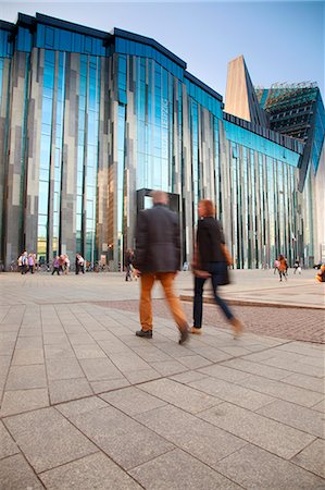 Germany, Saxony, Leipzig. Couple walking in front of the New main Modern building of the famed Leipzig University. Stock Photo - Rights-Managed, Code: 862-07909835