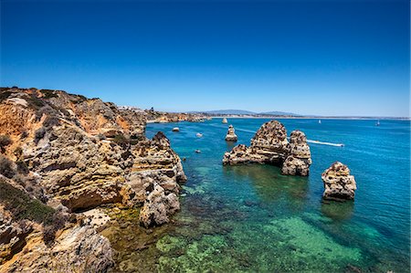 Rocky coast, Praia do Camilo, Lagos, Algarve, Portugal Stock Photo - Rights-Managed, Code: 862-07910608