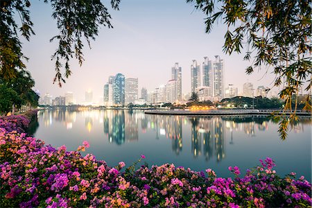 financial district in asia - Thailand, Bangkok. View of the city from Benjakiti park at dusk Stock Photo - Rights-Managed, Code: 862-07910813
