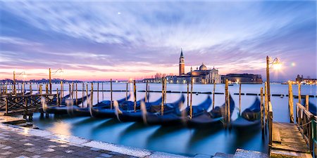 simsearch:862-07690164,k - Italy, Veneto, Venice. Row of gondolas moored at sunrise on Riva degli Schiavoni Stock Photo - Rights-Managed, Code: 862-08090422