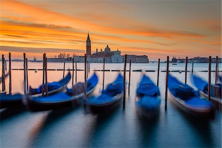 simsearch:862-07690164,k - Moored gondolas with San Giorgio Maggiore island in the background at sunrise, Venice, Veneto, Italy Stock Photo - Rights-Managed, Code: 862-08090618