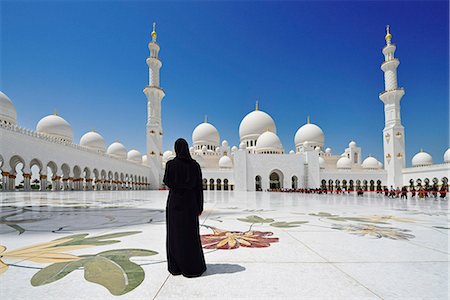 Woman in a black burkha stands in front of Sheikh Zayed Mosque, Abu Dhabi, United Arab Emirates Stock Photo - Rights-Managed, Code: 862-08091347