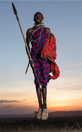 simsearch:841-03673550,k - Kenya, Mara North Conservancy. A Maasai warrior jumps high. Stock Photo - Rights-Managed, Code: 862-08273587