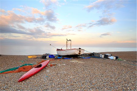 suffolk - England, Suffolk, Aldeburgh. Boat and fishing paraphernalia on the shingle beach at dusk. Stock Photo - Rights-Managed, Code: 862-08699242