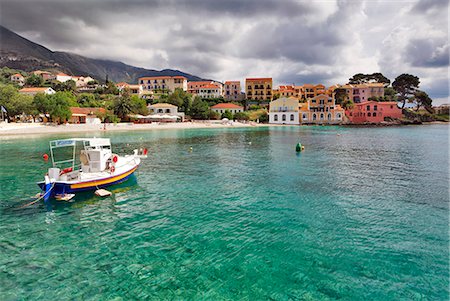 Greece, Kefalonia, Assos. A fishing boat under a cloudy sky. Stock Photo - Rights-Managed, Code: 862-08699276