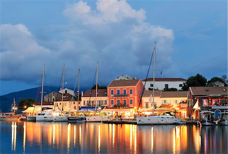 Greece, Kefalonia, Fiskardo. Reflections of harbour lights at dusk. Stock Photo - Rights-Managed, Code: 862-08699277