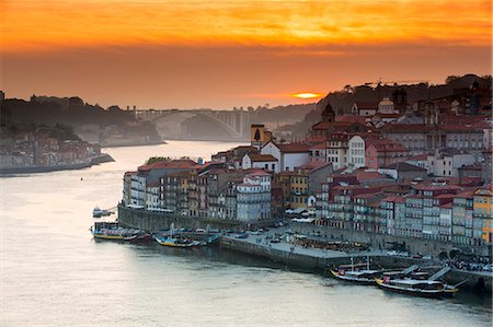 Portugal, Douro Litoral, Porto. Sunset over the UNESCO listed Ribeira district, viewed from Dom Luis I bridge Stock Photo - Rights-Managed, Code: 862-08699758