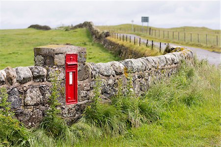 Scotland, Argyll and Bute, Isle of Tiree. A red post box in a stone wall. Stock Photo - Rights-Managed, Code: 862-08700008