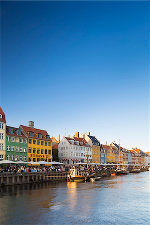 Denmark, Hillerod, Copenhagen. Colourful buildings along the 17th century waterfront of Nyhavn. Stock Photo - Rights-Managed, Code: 862-08718576