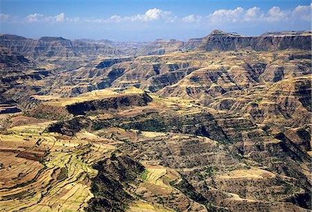 Ethiopia, Amhara Region, Simien Mountains.  The spectacular terrain in the foothills of the high-altitude Simien Mountains arises from the uplifting and erosion of lava from volcanic eruptions 20-30 million years ago. Stock Photo - Rights-Managed, Code: 862-08718796