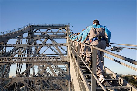 A group of climbers make their way up the steel girders of Brisbane's Story Bridge. The Story Bridge Adventure Climb commenced in 2005 and is one of only four such experiences in the world. Stock Photo - Rights-Managed, Code: 862-03288661