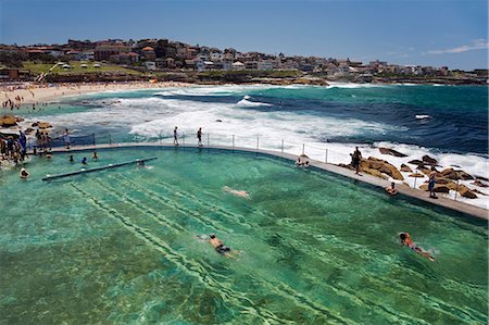 Swimmers do laps at the Bronte baths - ocean filled pools flanking the sea at Sydney's Bronte Beach Stock Photo - Rights-Managed, Code: 862-03288792