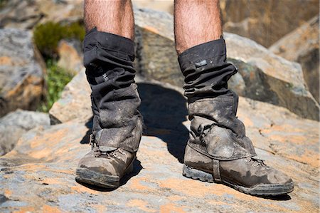 A trekker's muddy boots after hiking the overland Track,Tasmania. . Stock Photo - Rights-Managed, Code: 862-03289026