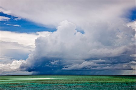Austrailia,Queensland. A heavy rainstorm over the Great Barrier Reef near Port Douglas. Stock Photo - Rights-Managed, Code: 862-03289185