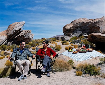 Tourists on the Explora Traversia of southern Bolivia enjoy a picnic lunch in the sunshine close to Laguna Turquiri Stock Photo - Rights-Managed, Code: 862-03289462