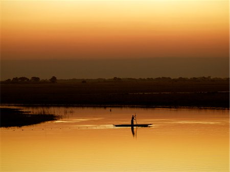 simsearch:862-03355195,k - A fisherman at sunset on the Chobe River. Stock Photo - Rights-Managed, Code: 862-03289631