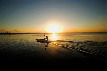 simsearch:862-07495921,k - Brazil,Bahia,Barra de Serinhaem. Young man canoeing at sunset. Stock Photo - Rights-Managed, Code: 862-03289791