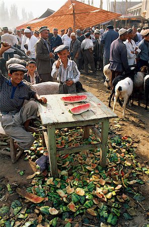 Uigur boys sell water melons from their stall at Kashgar's Sunday Market Stock Photo - Rights-Managed, Code: 862-03289870