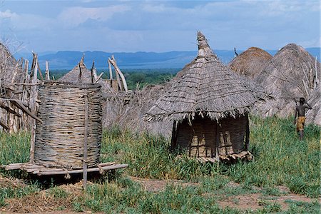 simsearch:862-03353978,k - The grass huts and granary stores of a Nyangatom settlement. The Nyangatom or Bume are a Nilotic tribe of semi-nomadic pastoralists who live along the banks of the Omo River in south-western Ethiopia. Stock Photo - Rights-Managed, Code: 862-03354068