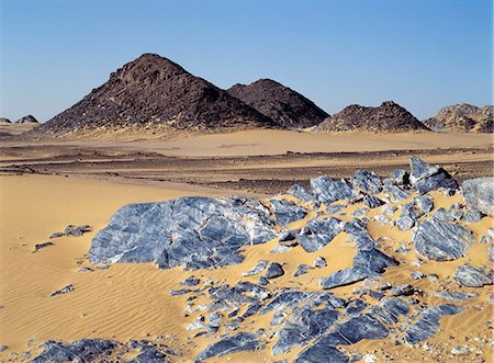 sudan - The Northern or Libyan Desert in northwest Sudan is an easterly extension of the great Sahara Desert. The erosion of sedimentary rock has created a truly magnificent desert landscape. Stock Photo - Rights-Managed, Code: 862-03354625