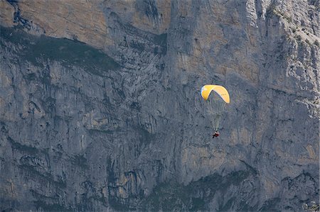 Switzerland,Bernese Oberland,Jungfrau. A paraglider alongside the Jungfrau mountain. Stock Photo - Rights-Managed, Code: 862-03354745