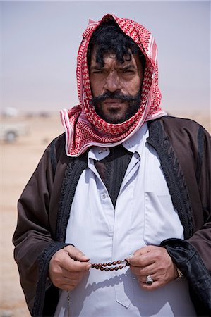 A bedouin at the camel races,Palmyra. The races are held every year as part of the Palmyra Festival,Syria Stock Photo - Rights-Managed, Code: 862-03354842