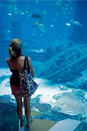 family, hotel - United Arab Emirates,Dubai,The Atlantis Palm Hotel. A massive aquaruim is the centre piece of one of Dubai's major new hotel developments with a huge collection of tropical fish and sharks. Stock Photo - Rights-Managed, Code: 862-03355354