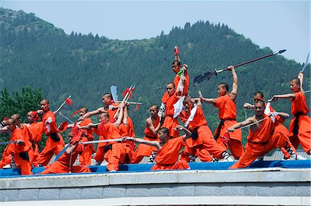 Kung Fu students displaying their skills at a tourist show within Shaolin Temple,Henan Province,China. Shaolin is the birthplace of Kung Fu martial art. Stock Photo - Rights-Managed, Code: 862-03351074