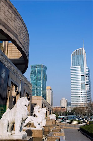 China,Shanghai. Shanghai Museum statues and modern buildings. Stock Photo - Rights-Managed, Code: 862-03351620