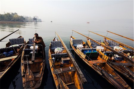 China,Zhejiang Province,Hangzhou. Boats on the waters of West Lake. Stock Photo - Rights-Managed, Code: 862-03351632