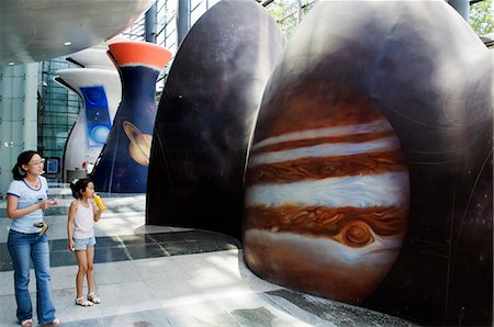 planetarium - China,Beijing. Visitors looking at a display at the Planetarium Museum Stock Photo - Rights-Managed, Code: 862-03351844