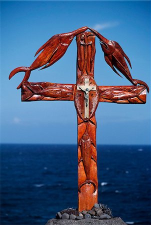 erect - Wooden cross on erected on the southern coast combining the Christian crucifix with carved emblems of the fish from the surrounding sea Stock Photo - Rights-Managed, Code: 862-03352110