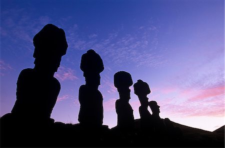 simsearch:862-03360742,k - Chile,Easter Island,Anakena. Ahu Nau Nau,the standing Moai statues topped with red scoria headdresses (known as Pukao). Stock Photo - Rights-Managed, Code: 862-03352202