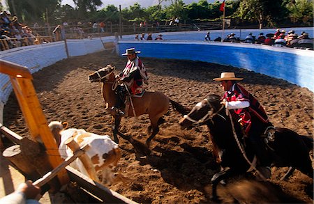 poncho - Chile,Cabildo. Huasos taking part in a traditional Rodeo in the village of Cabildo. Stock Photo - Rights-Managed, Code: 862-03352287