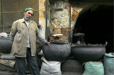 simsearch:846-02796313,k - A charcoal seller standing outside his shop in Islamic Cairo. Charcoal is widely used as cooking fuel and for the smoking the ubiquitoius shisha,or water pipe. Stock Photo - Rights-Managed, Code: 862-03352741