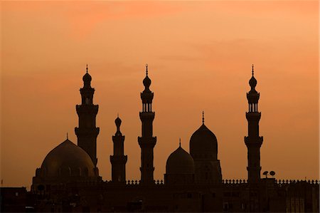 The minarets of the beautiful Sultan Hassan Mosque silhouetted against the setting sun,Cairo,Egypt Stock Photo - Rights-Managed, Code: 862-03352828