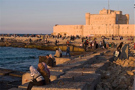 Friends and couples gather at sunset outside the Citadel of Quatbai,Alexandria,Egypt Stock Photo - Rights-Managed, Code: 862-03352865