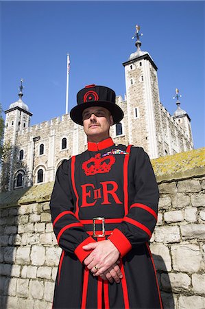 A beafeeter in traditional dress outside the Tower of London. Stock Photo - Rights-Managed, Code: 862-03353169