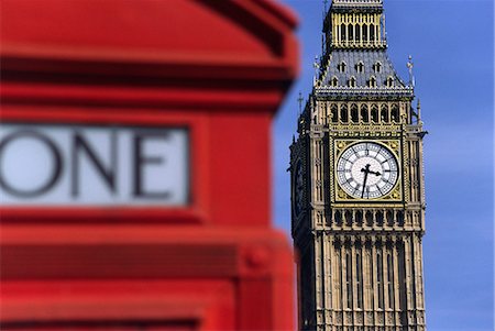 London's famous Clock Tower,Big Ben,is viewed from behind another English icon - the red phone booth. Big Ben's name actually comes from the 13 tonne bell hanging inside the tower and named after its commissioner,Benjamin Hall Stock Photo - Rights-Managed, Code: 862-03353313