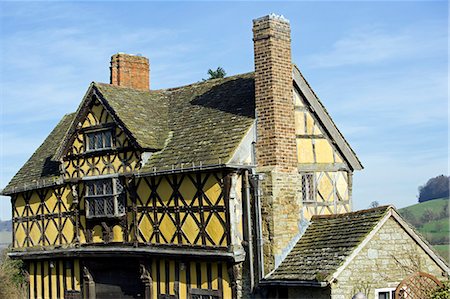 England,Shropshire,Stokesay Castle,located at Stokesay,a mile south of the town of Craven Arms,in South Shropshire,is the oldest fortified manor house in England,dating to the 12th century and is managed by England Heritage. Detail of the classic medieval architecture of the Gatehouse is highlighted. Stock Photo - Rights-Managed, Code: 862-03353642