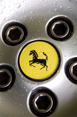 Ferrari logo on wheel of sportscar Stock Photo - Rights-Managed, Code: 862-03353734